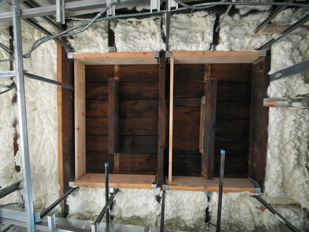 Closed-cell spray foam insulation applied between framing members