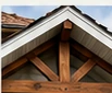 Stained wood gable bracket detail for an upgraded exterior.