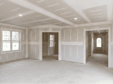 Finished Level 3 drywall interior with taped seams and white joint compound
