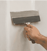 Second fill coat applied wider than first drywall coat