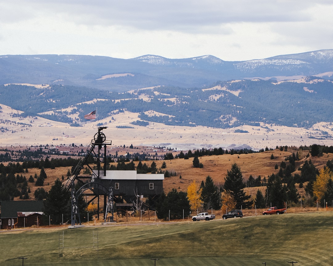 A bar chart comparing estimated 2026 cost-per-square-foot ranges across Montana regions like Bozeman, Missoula, Billings, and Flathead
