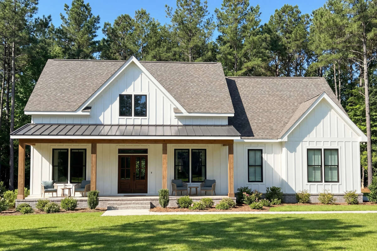 Front elevation rendering of Modern Farmhouse Plan 009-00294 with board-and-batten siding and gabled entry